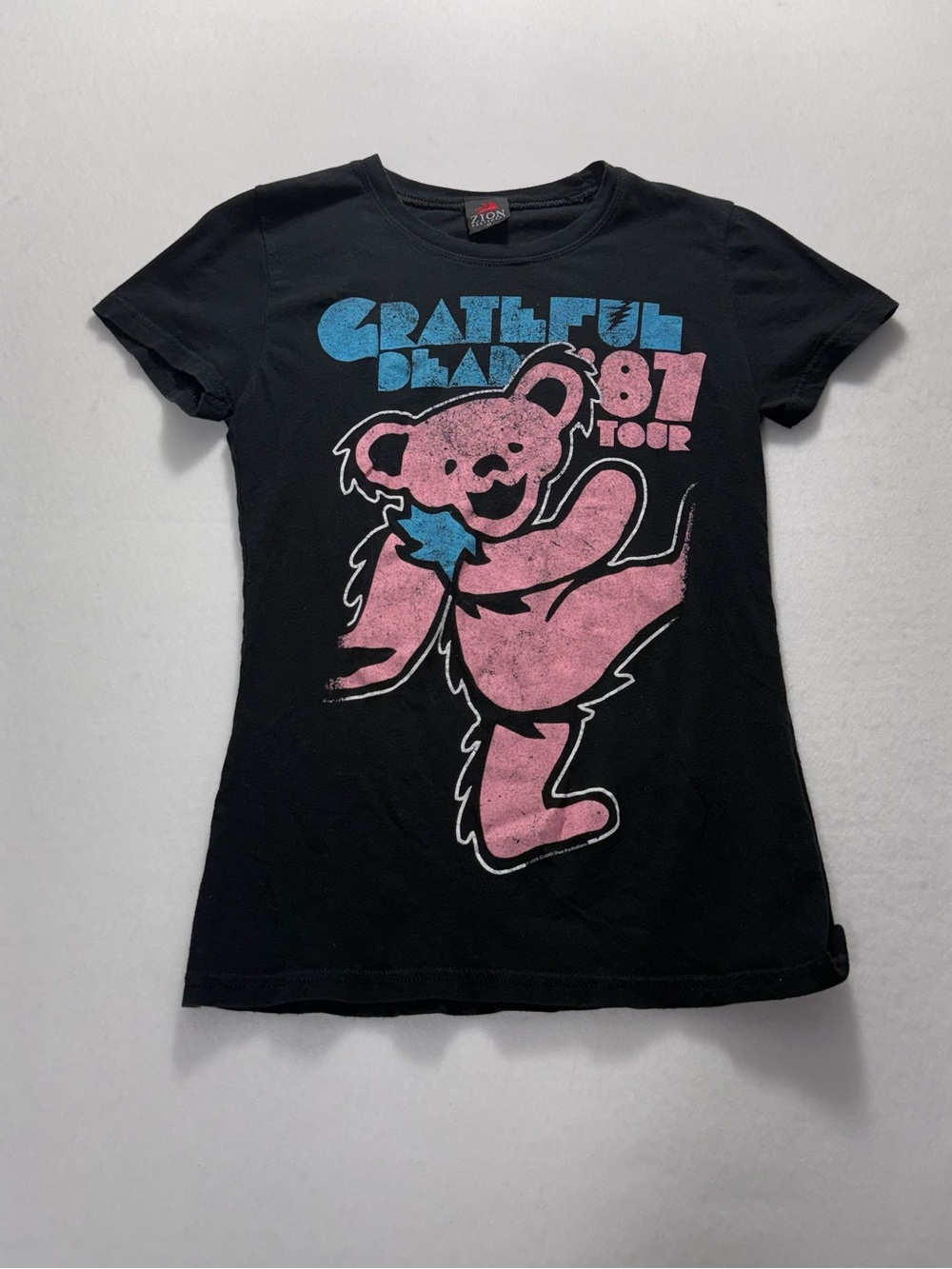 Zion Rootswear Black Tee with Pink Bear & Blue Text